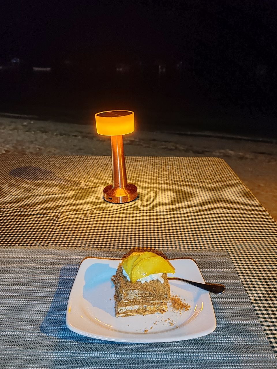 Mango dessert by the beach at night